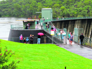 Irrigators celebrate as Moogerah spills, wary of further rain