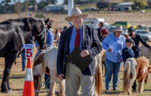 Decades speaking, John’s voice carries from show to show