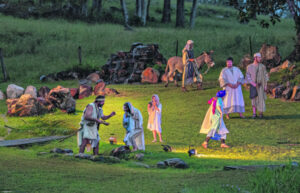 Thousands attend passion play despite weather woes