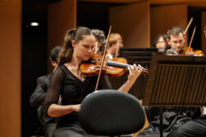 Queensland Symphony Orchestra 1st violin began, age two, in Ipswich