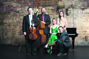 Show about disaster, postponed by floods, vows to rise