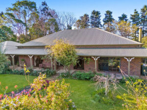 Craftsman built, lush gardens and mountain views